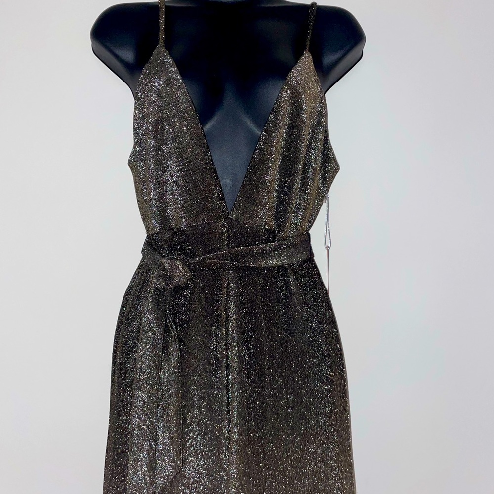 Super cute jumpsuit right on time for a holiday party! Never been worn.